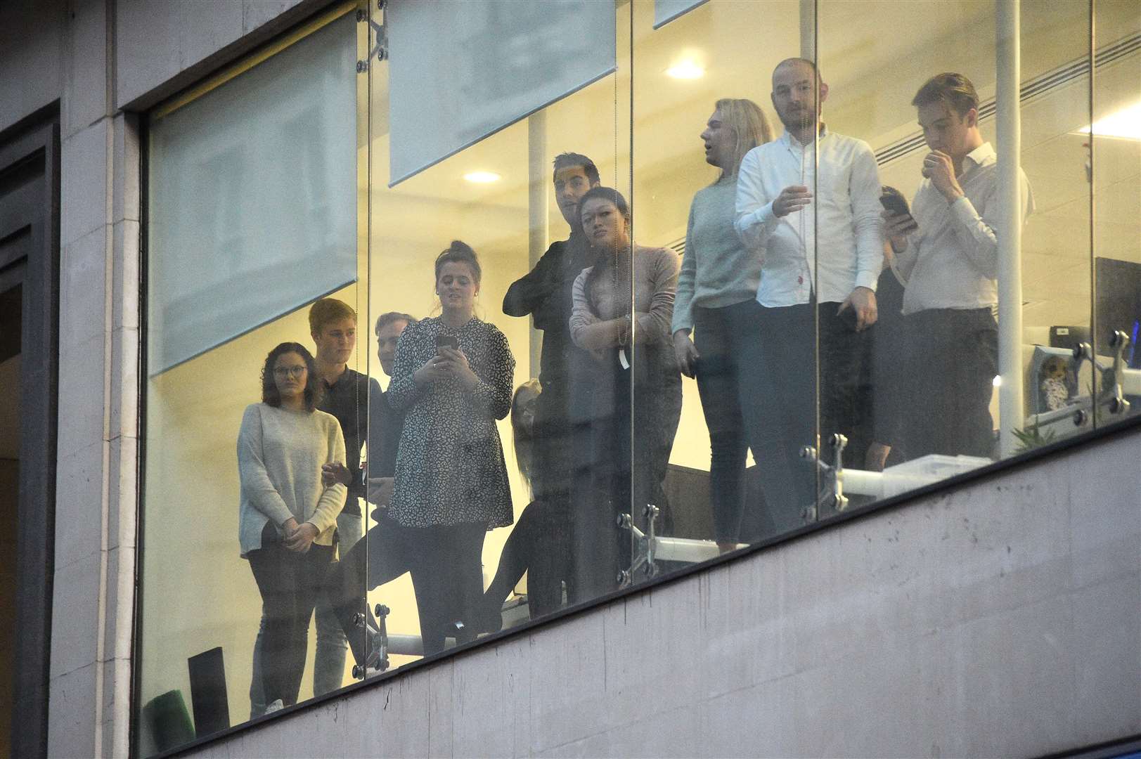 Office workers watching police near the scene of an incident on London Bridge in central London (Kirsty O’Connor/PA)