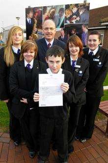 Paul with some of his students, from left, Vicky Boorman, 15, Lauren Glock, 13, Gary Caffell, 12, Abigail Silk, 15, and Abbey Brown, 15.