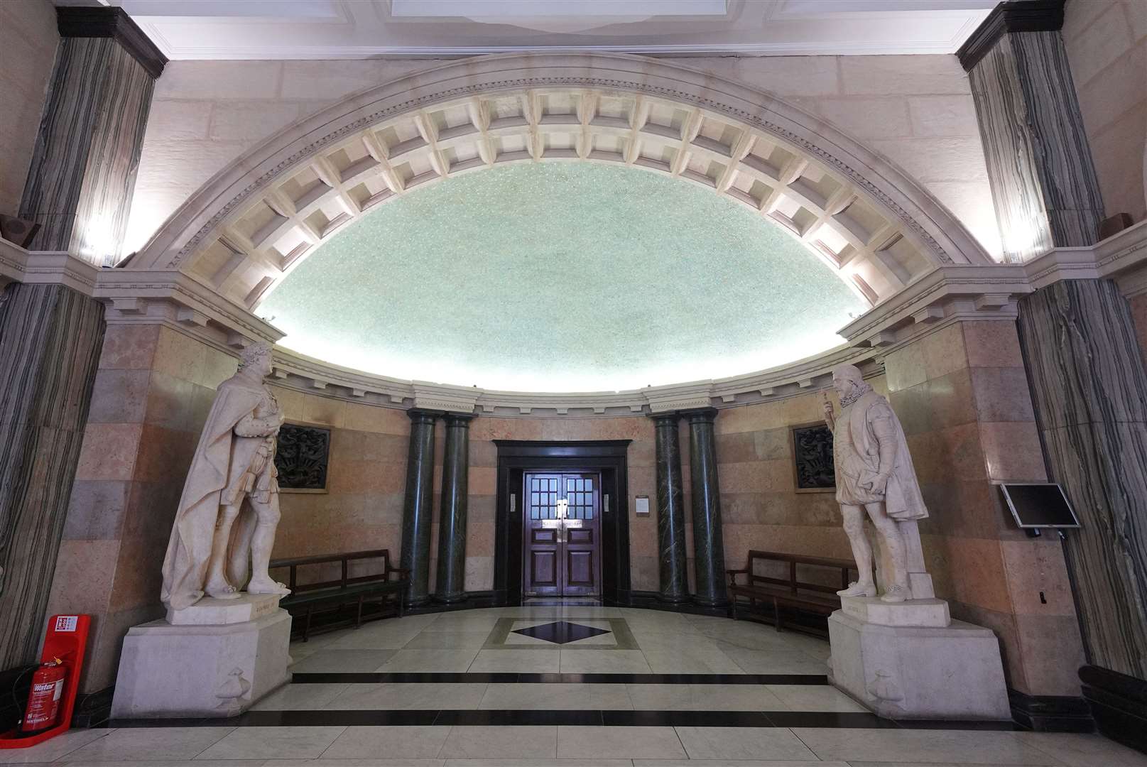 Statues of William IV holding a scroll (left) and William III holding an orb, at the whispering gallery in the Old Bailey, said to be constructed so that one person can whisper a secret from one side and be heard on the other due to its unusual acoustics (Yui Mok/PA)