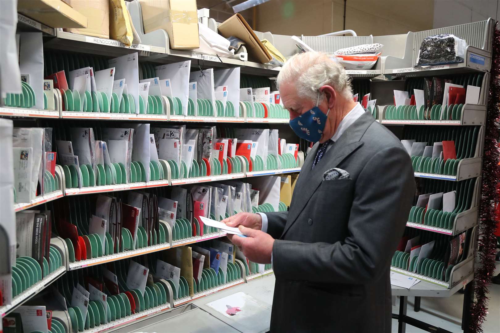 Charles found sorting the mail a little tricky at first (Geoff Caddick/PA)