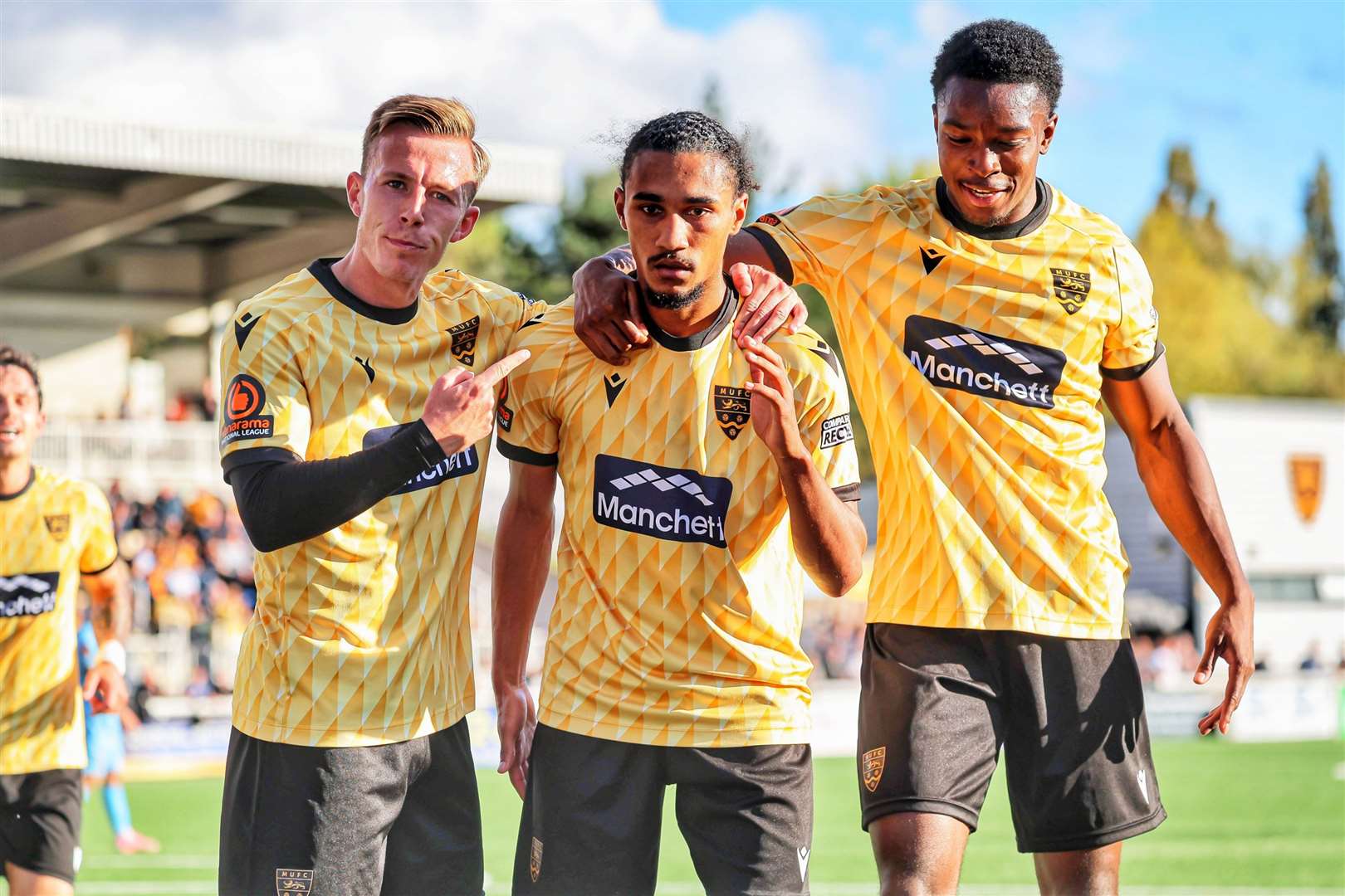 Maidstone goalscorer Aaron Blair, centre, with Sam Corne and Raphe Brown. Picture: Helen Cooper