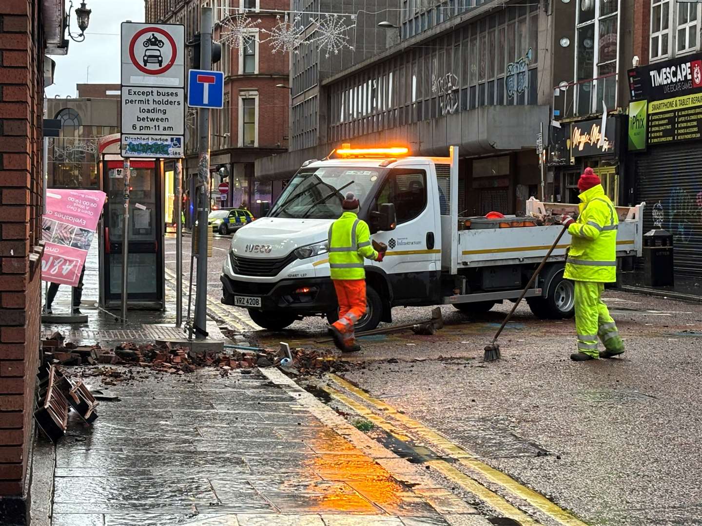 The clean-up operation in Castle Street in Belfast city centre (Rebecca Black/PA)