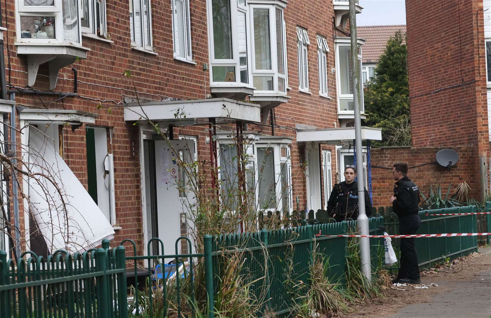 Police outside flat when it exploded in February