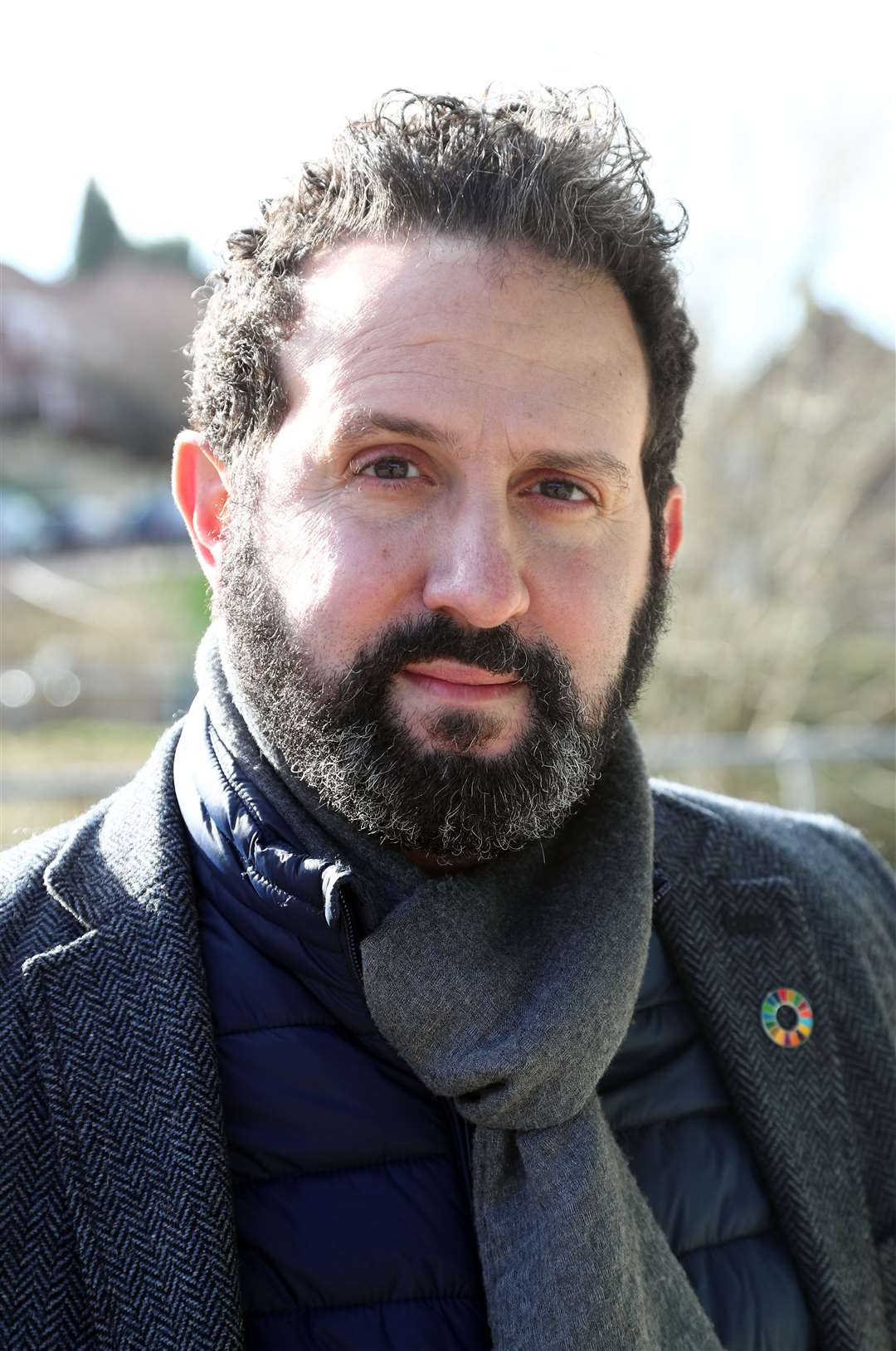 Councillor Samer Bagaeen speaks to reporters outside the County Oak Medical Centre in Brighton in February (Gareth Fuller/PA)