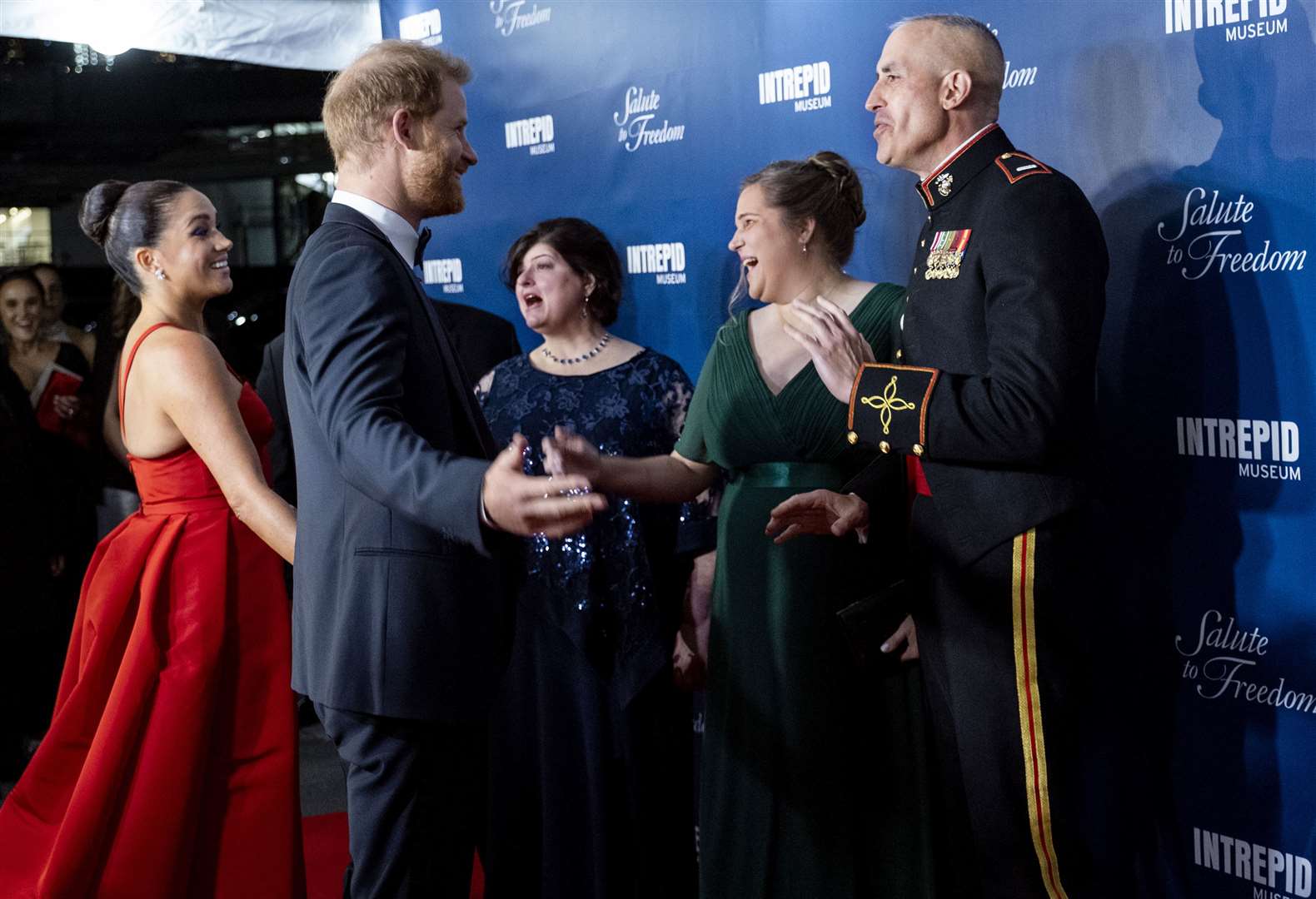 The Duke and Duchess of Sussex, greet Stephen Rudinski, right, a Valor Award recipient, and others, as they arrive at the Intrepid Sea, Air & Space Museum (Craig Ruttle/AP)