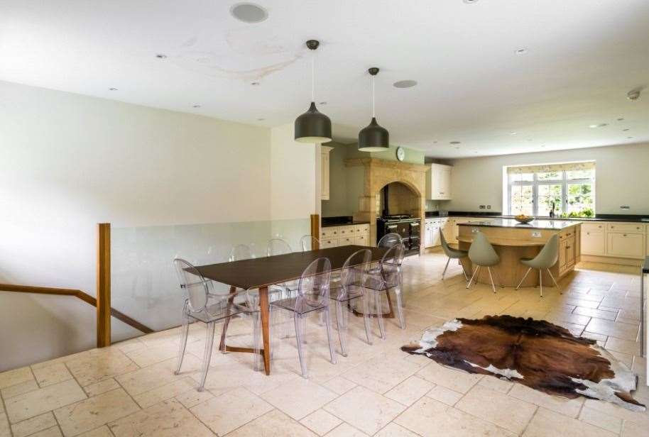The light and bright kitchen with breakfast room has a number of top cooking appliances. Picture: Hamptons