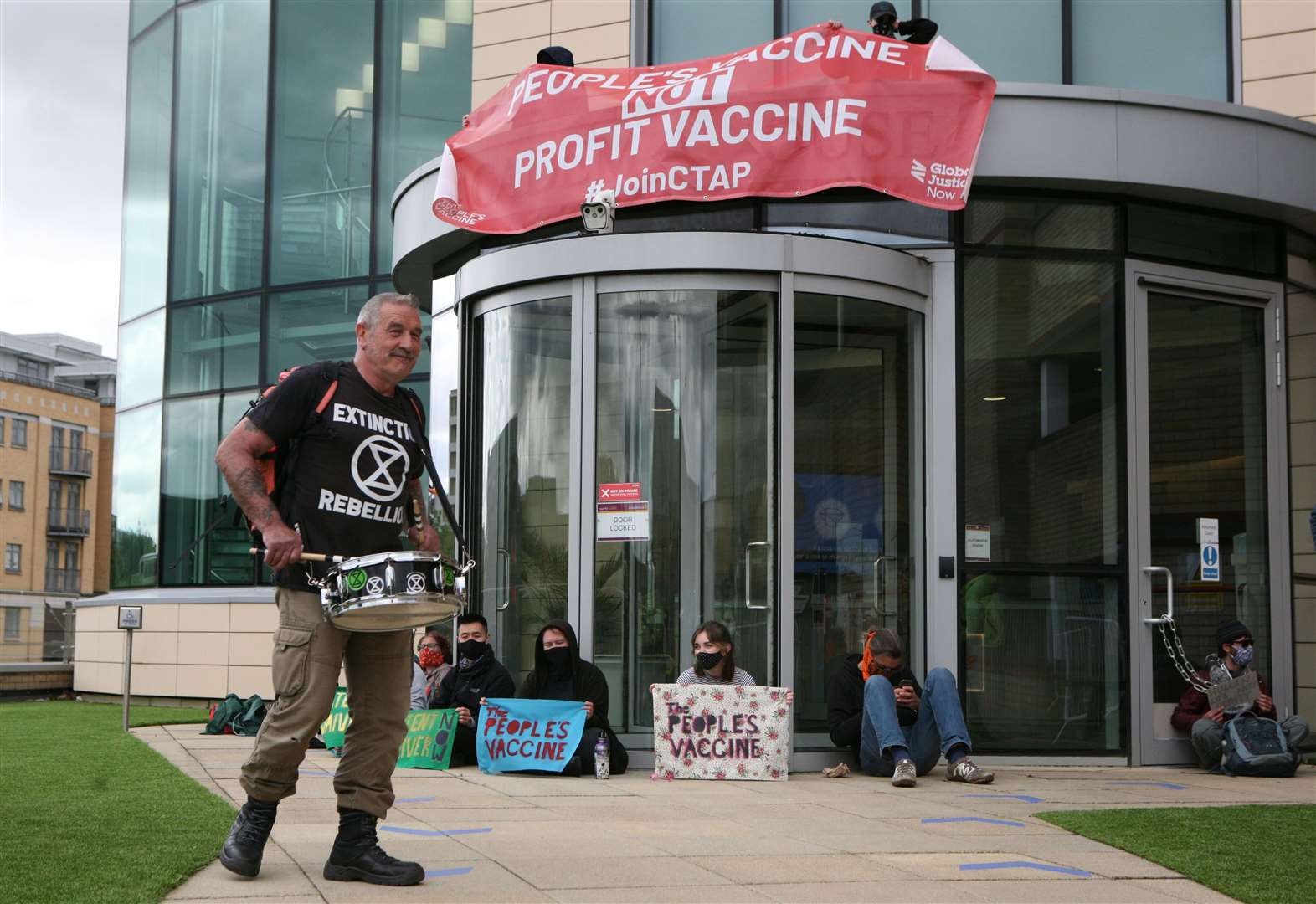 Protesters gather outside AstraZeneca’s HQ in Cambridge (Luciana Guerra/PA)