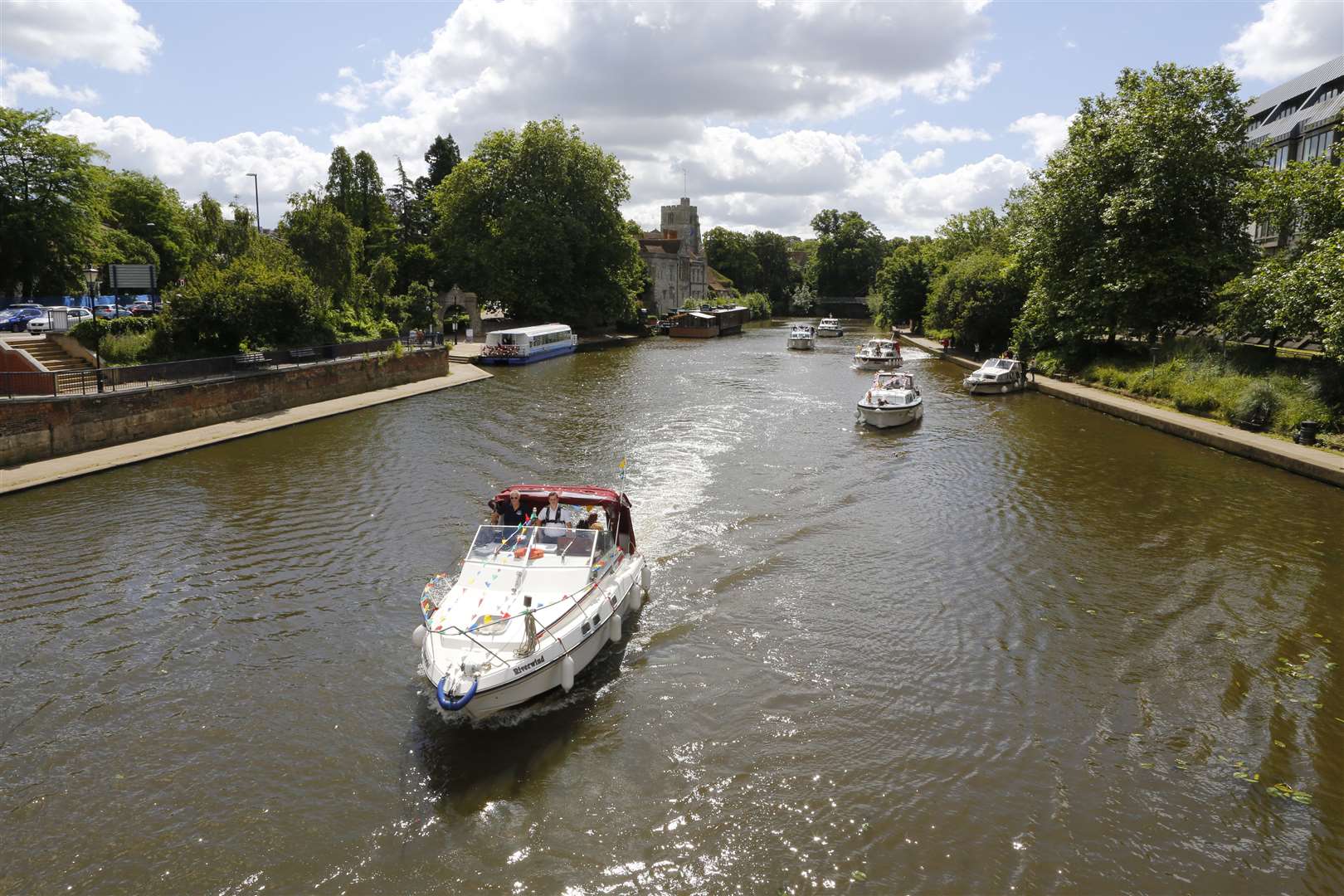 The boats make their way down the River Medway