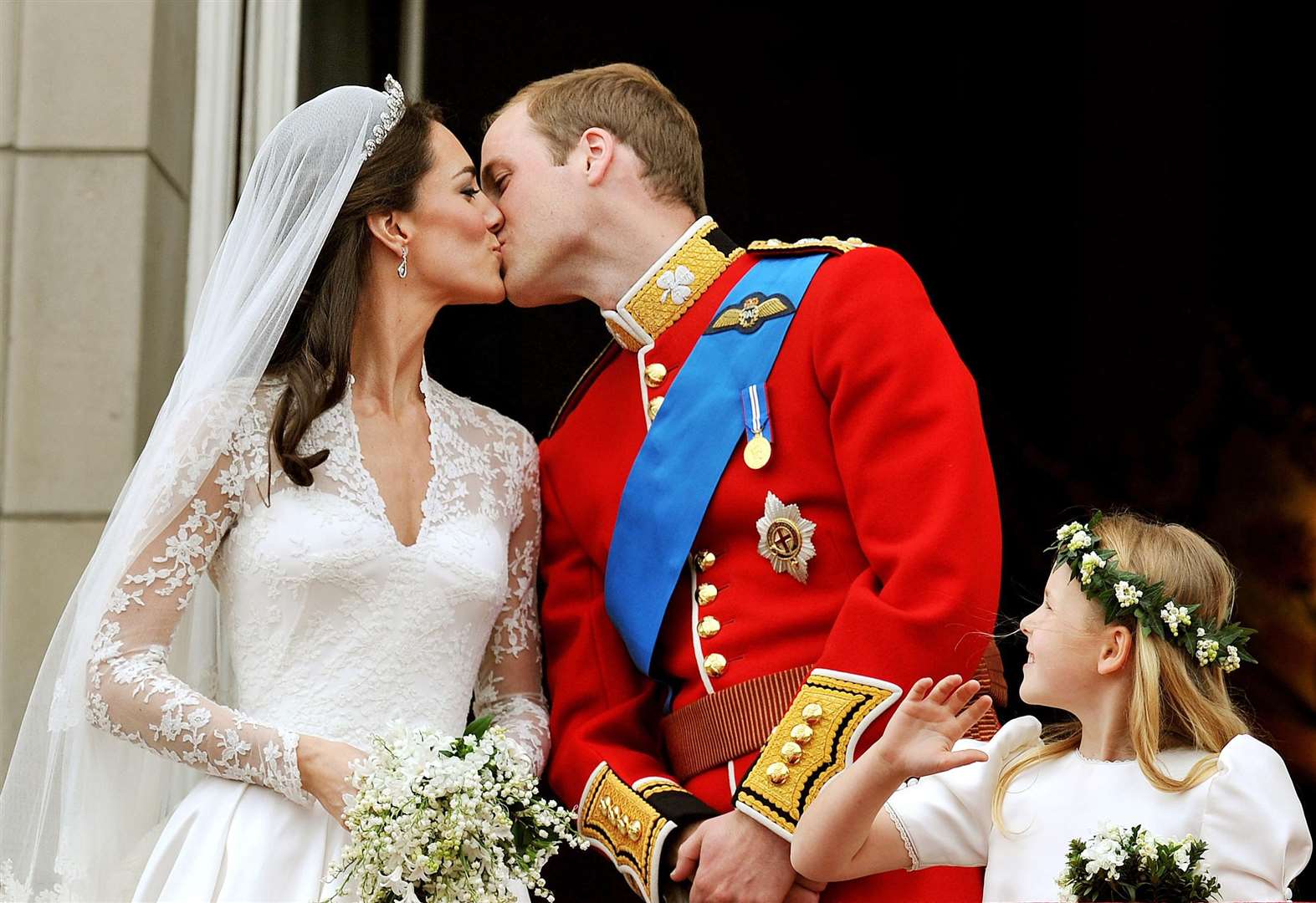 William and Kate kiss on the Palace balcony on their wedding day in 2011 (John Stillwell/PA)