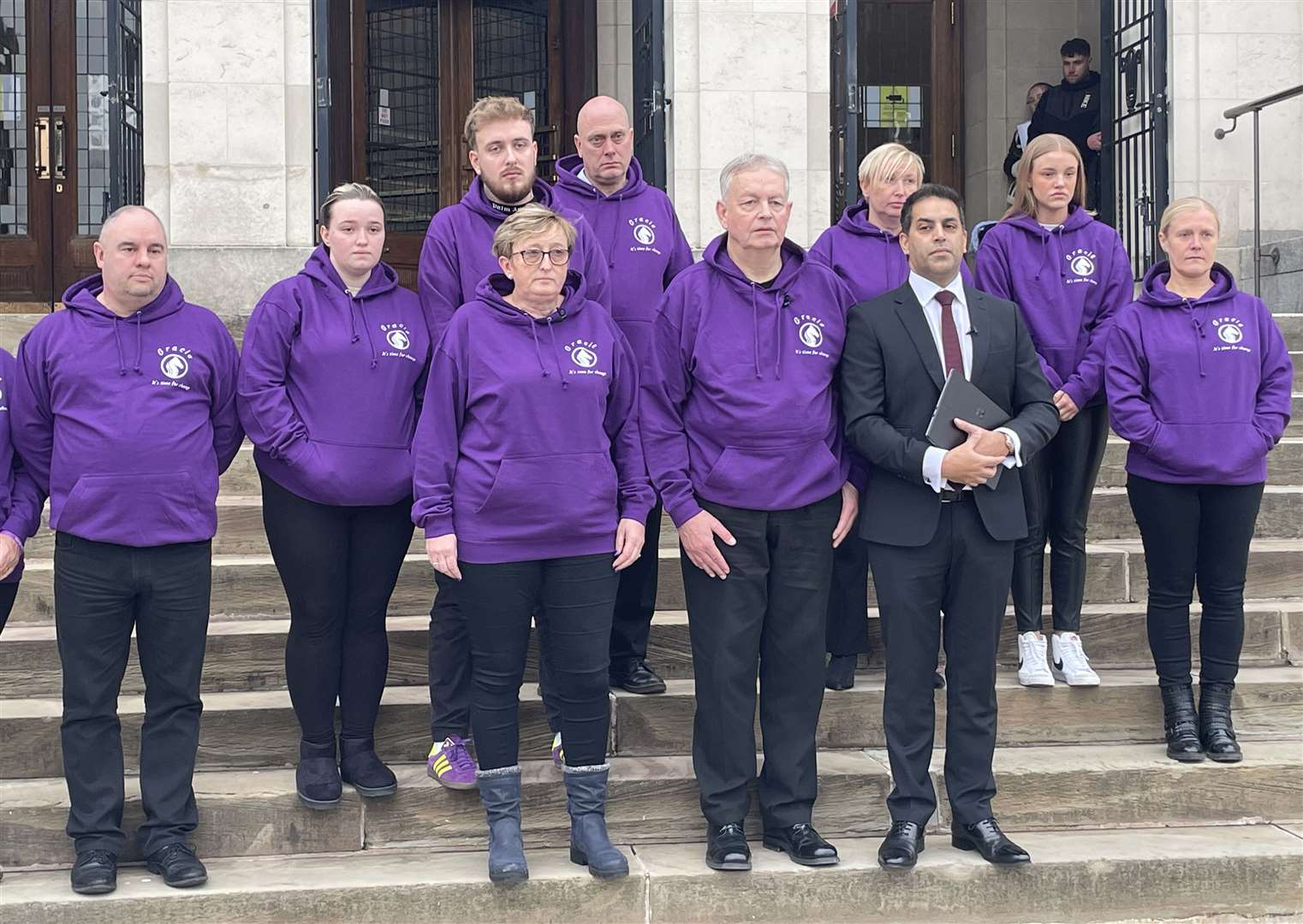 Alison Ward and Richard Spinks join friends and family outside Chesterfield Coroner’s Court at the conclusion of the inquest into their daughter’s death (Callum Parke/PA)