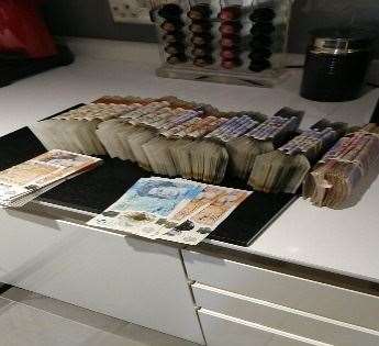 A picture of cash in Catherine Roche’s kitchen that was found on her encrypted phone (Organised Crime Partnership/PA)