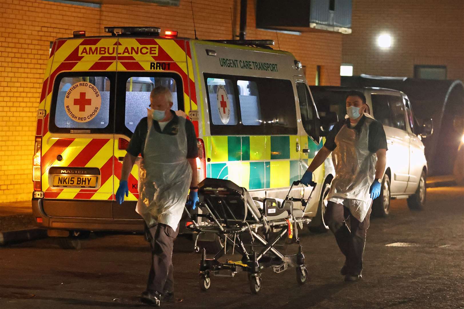 Medical staff return a bed to an ambulance at Antrim Area Hospital (Liam McBurney/PA)