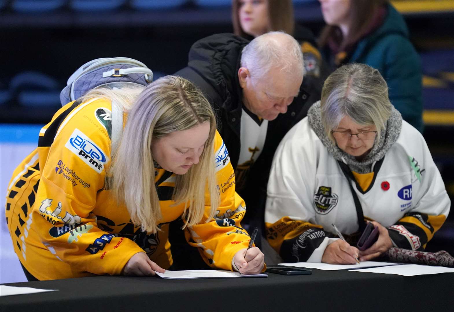 Supporters sign a book of condolence (Zac Goodwin/PA)