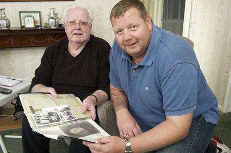 Martin Jackson, of Racefield Close, Shorne Ridgeway, and son Michael, look over memorabilia for Martin's father Sgt William Jackson. Sgt Jackson was killed in action in Italy in 1943.