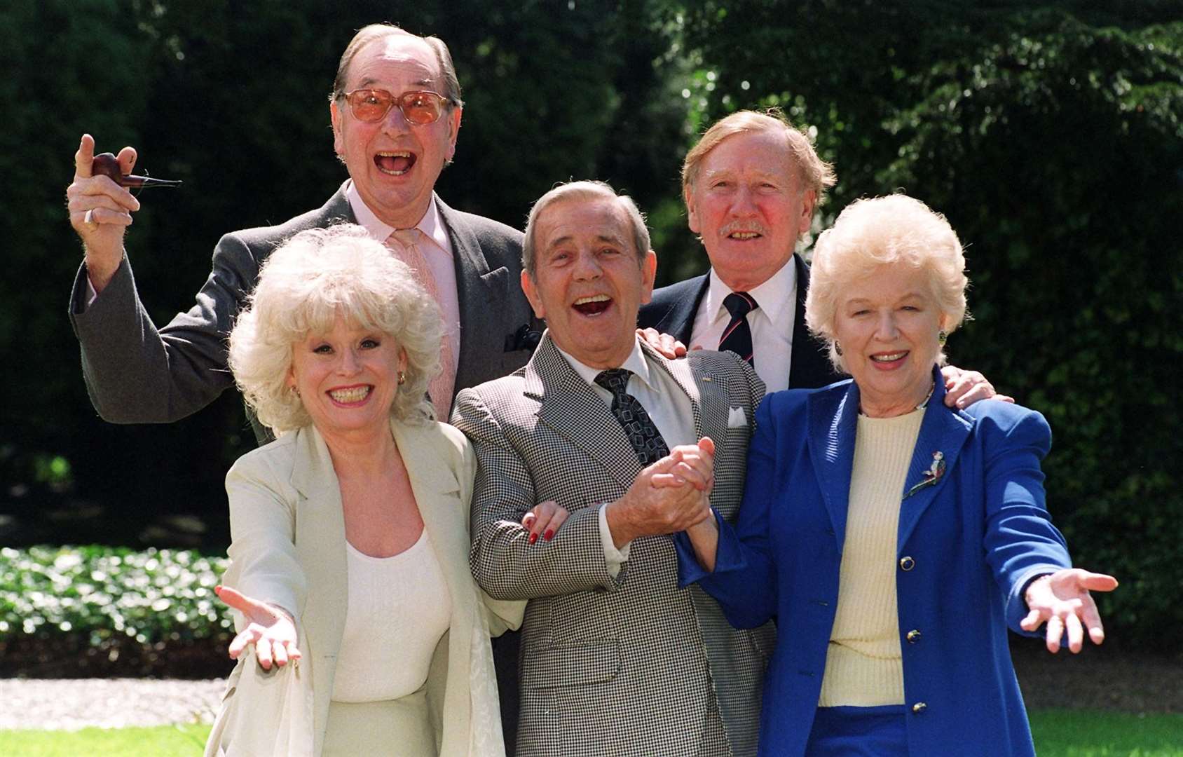 Leslie Phillips with the stars of the Carry On films including Jack Douglas, Dame Barbara Windsor and Dame June Whitfield (PA)