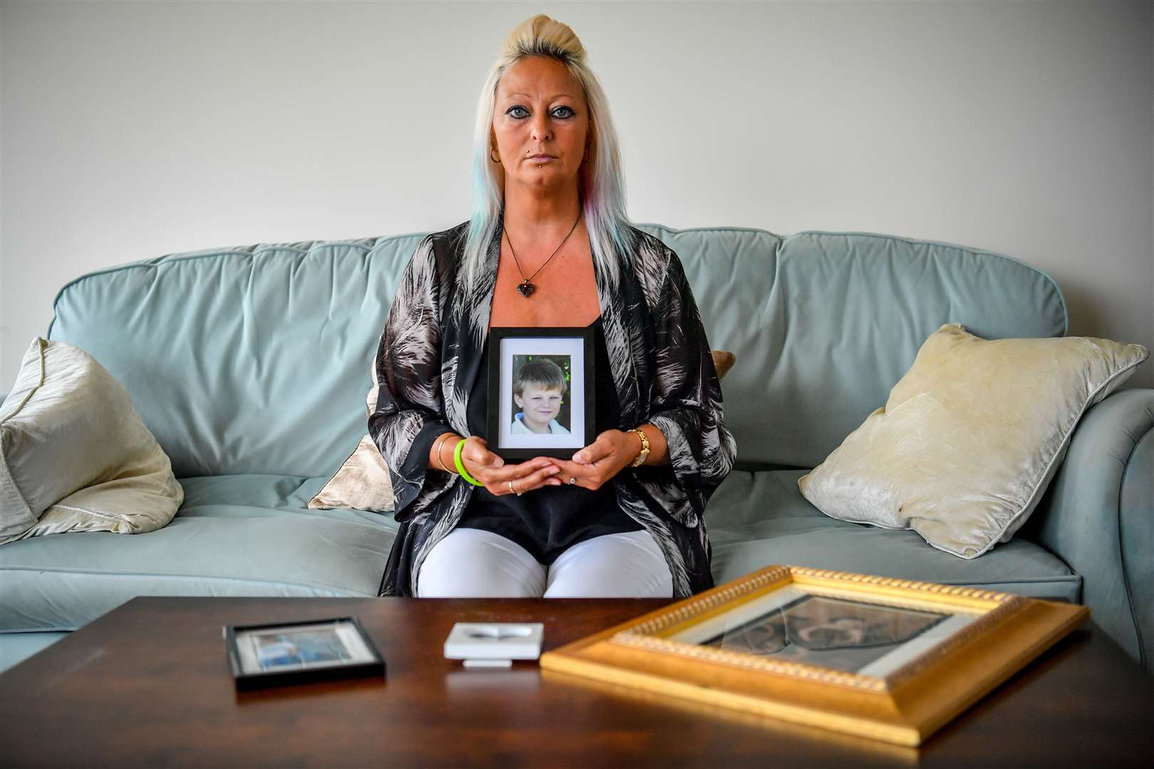 Charlotte Charles, mother of Harry Dunn holding a photograph of him aged 14 (Family handout/PA)