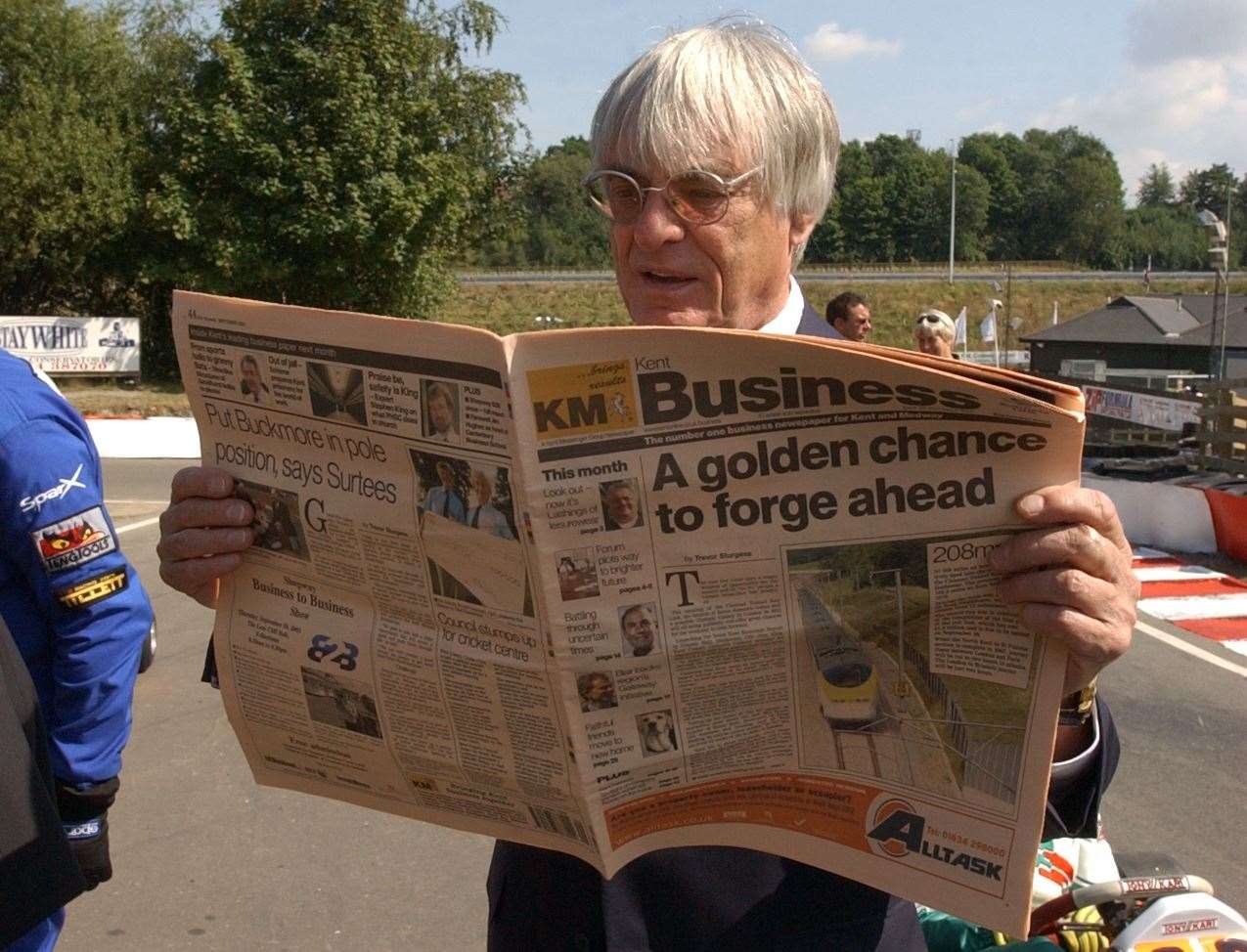 Read all about it: Ecclestone picked up a KM paper during his visit to Buckmore in 2003. Picture: Jim Rantell
