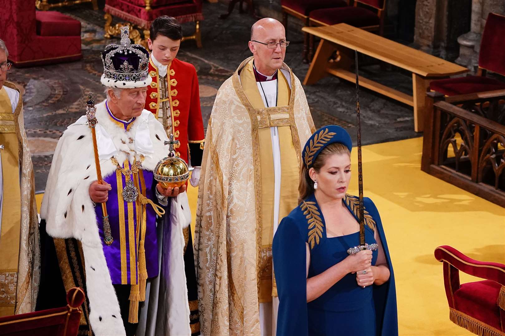 Penny Mordaunt walking ahead of the King (Yui Mok/PA)