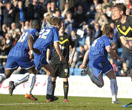 Simon King wheels away with delight after scoring