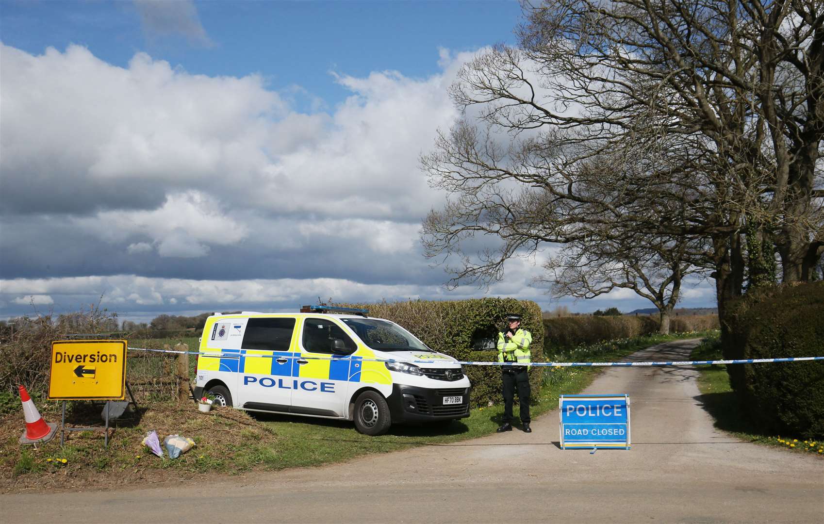 A police officer in Gillingham, Dorset, following the death of Sir Richard Sutton (Jonathan Brady/PA)