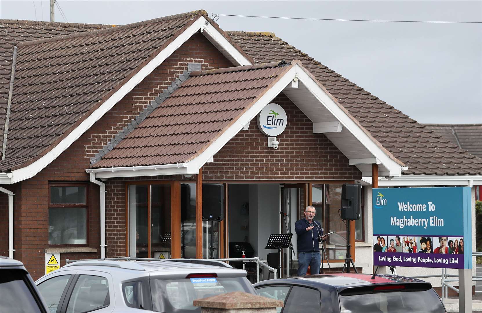 A pastor preaches during a drive-in service at Maghaberry Elim Pentecostal Church in Craigavon in Northern Ireland (Brian Lawless/PA)