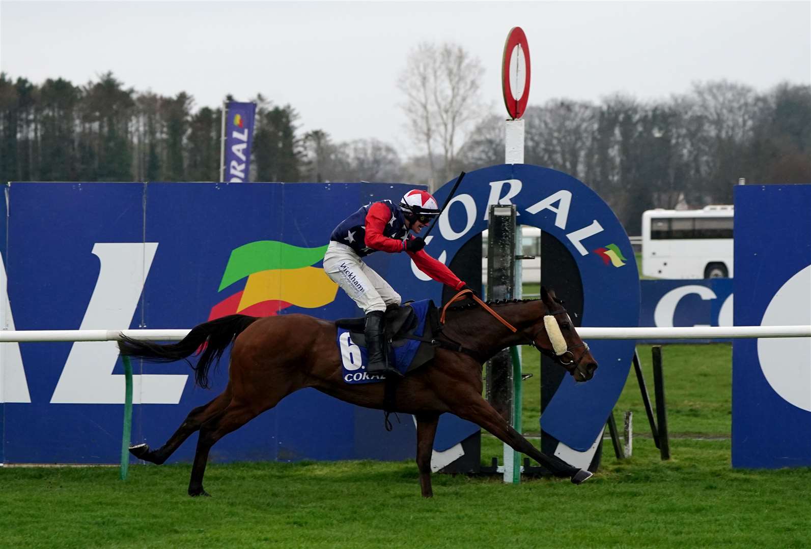 Kitty’s Light, ridden by jockey Jack Tudor cross the finish line to win the Coral Scottish Grand National Handicap Chase (Jane Barlow/PA)