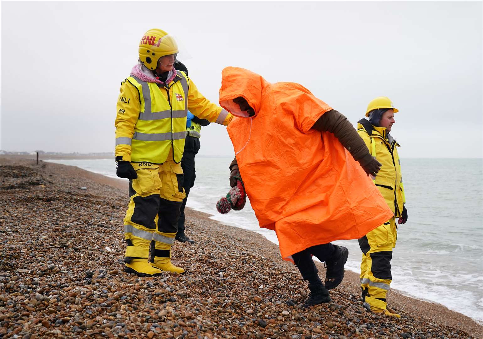 People thought to be migrants are brought in to Dungeness, Kent, after being rescued by the RNLI following a small boat incident in the Channel (Gareth Fuller/PA)