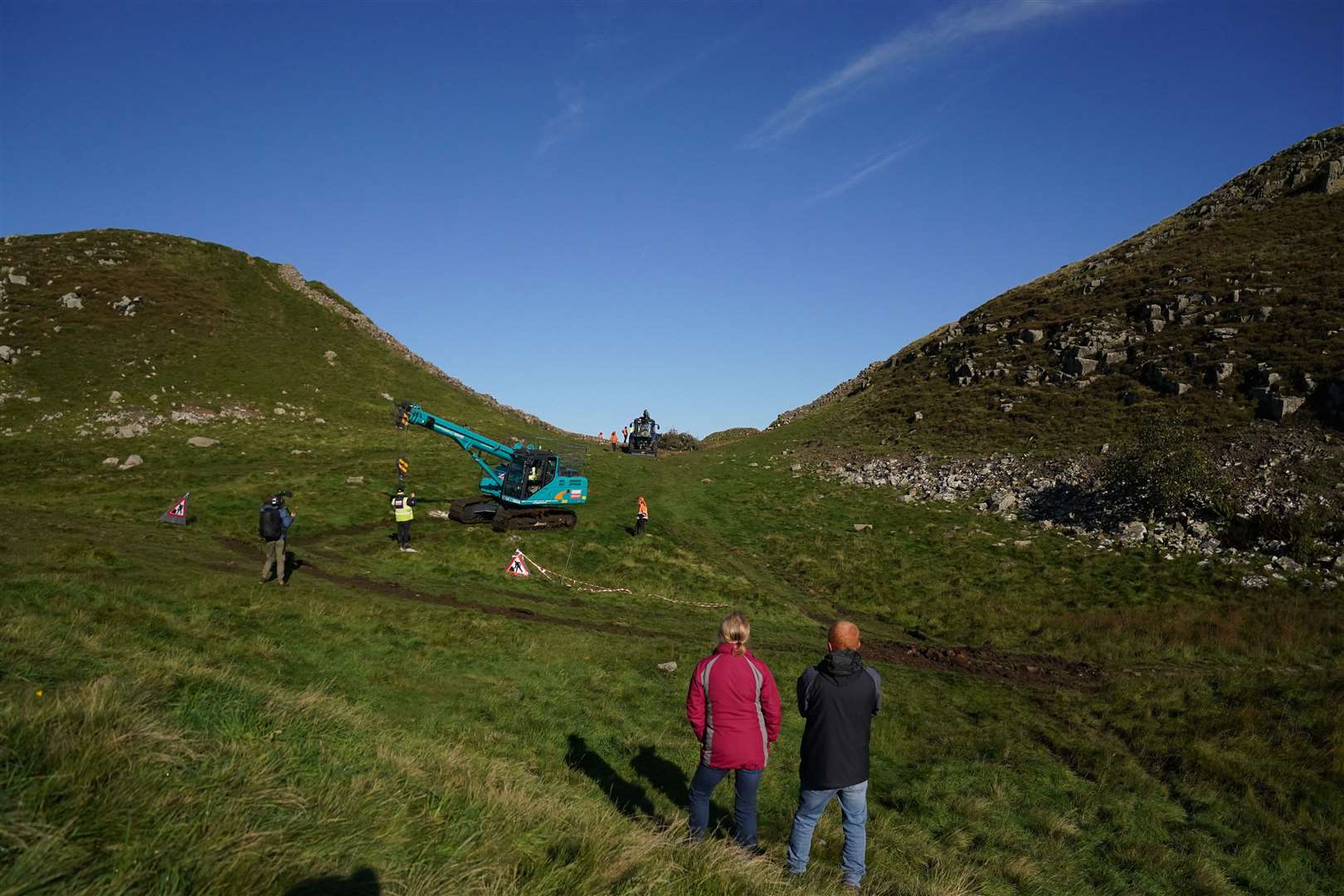 The work drew spectators to the Northumberland landmark (Owen Humphreys/PA)