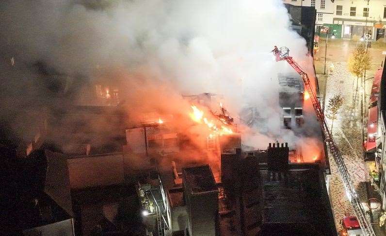 Firefighters tackle a huge blaze at the former Debenhams department store in Guildhall Street, Canterbury city centre. Picture: UKNIP