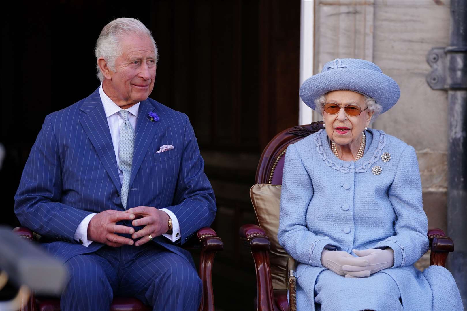 The Prince of Wales and the Queen attend the Queen’s Body Guard for Scotland Reddendo Parade in the gardens of the Palace of Holyroodhouse (Jane Barlow/PA)