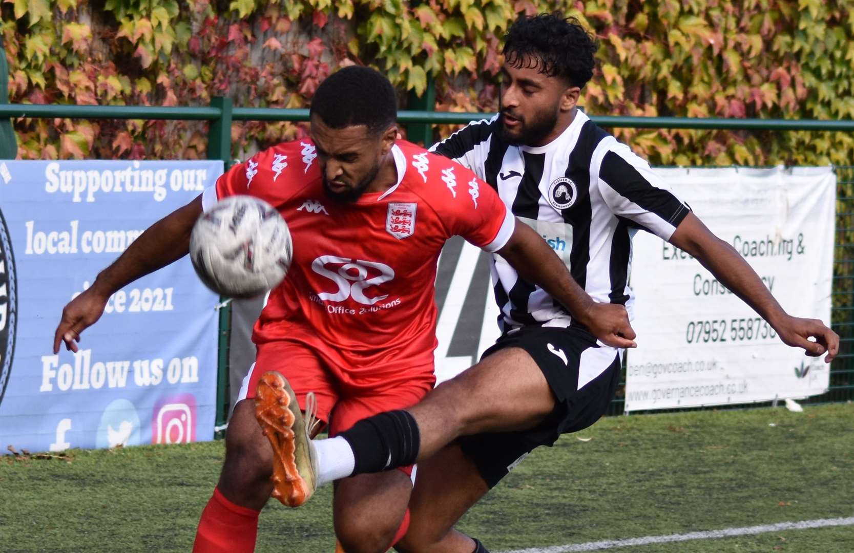 Faversham forward Johan Caney-Bryan is tackled by Fisher's Mayvin Vigneswaran in last weekend’s 3-1 victory for the Lilywhites. Picture: Alan Coomes