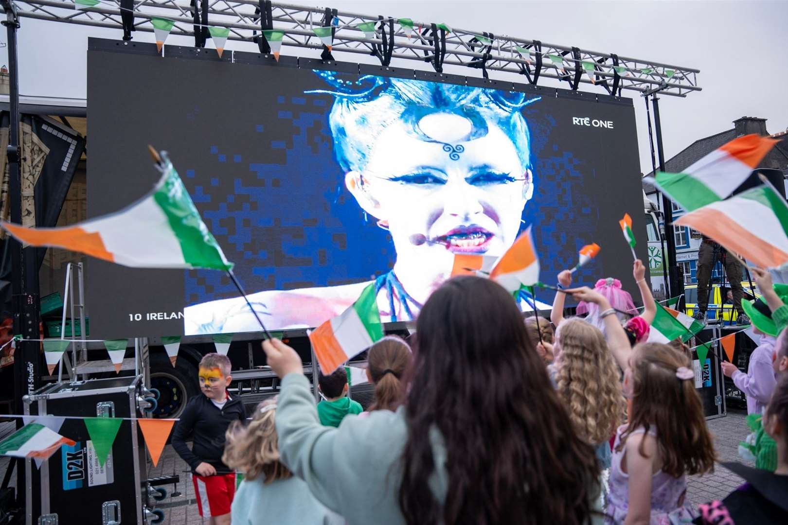 People attend a watch-along party in the town square of Ireland’s Eurovision entrant Bambie Thug’s hometown of Macroom in Co Cork, as the Eurovision final took place in Malmo (Noel Sweeney/PA)