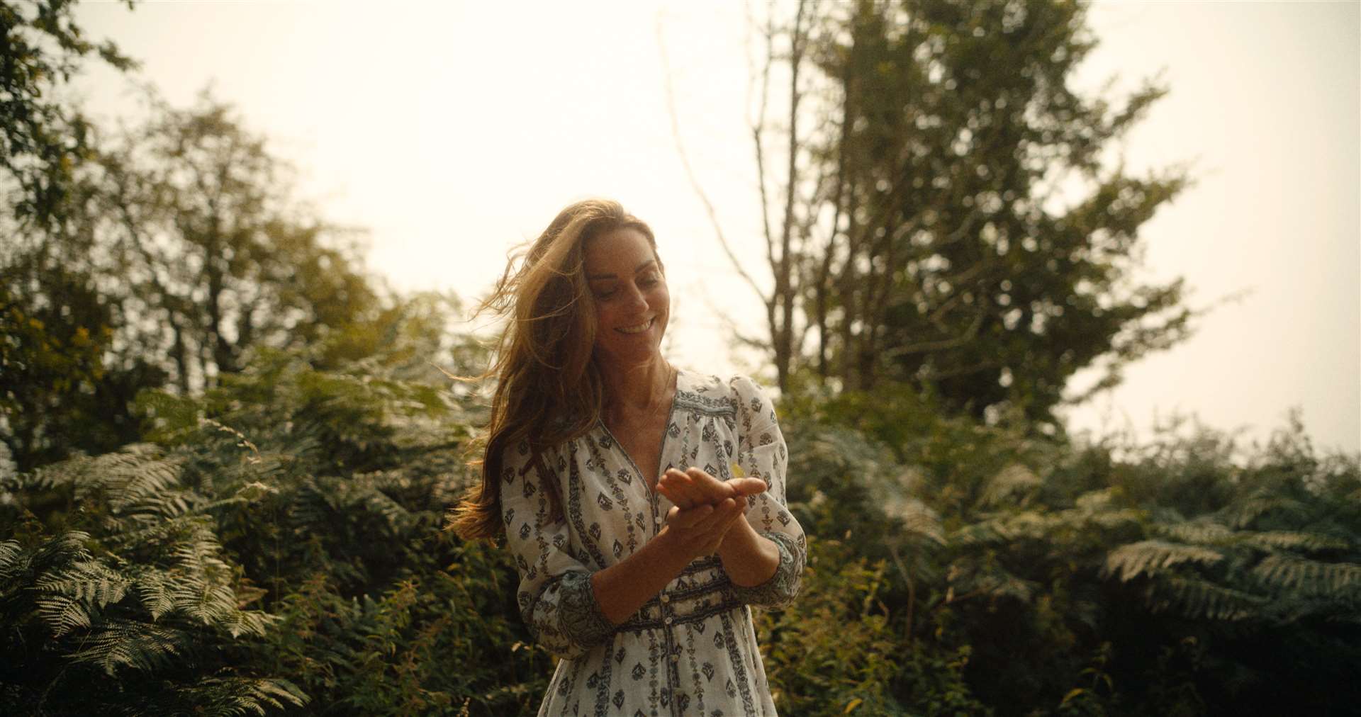 Kate holds a butterfly in her hands (Will Warr/Kensington Palace/PA)