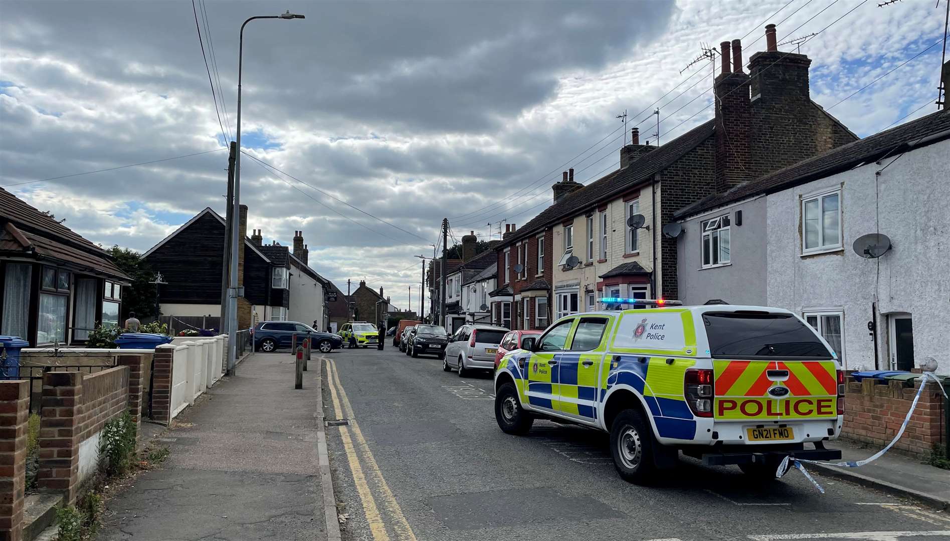 A patrol van in Eastchurchcaption textFirearms officers were called to the area after reports of someone with a weapon.