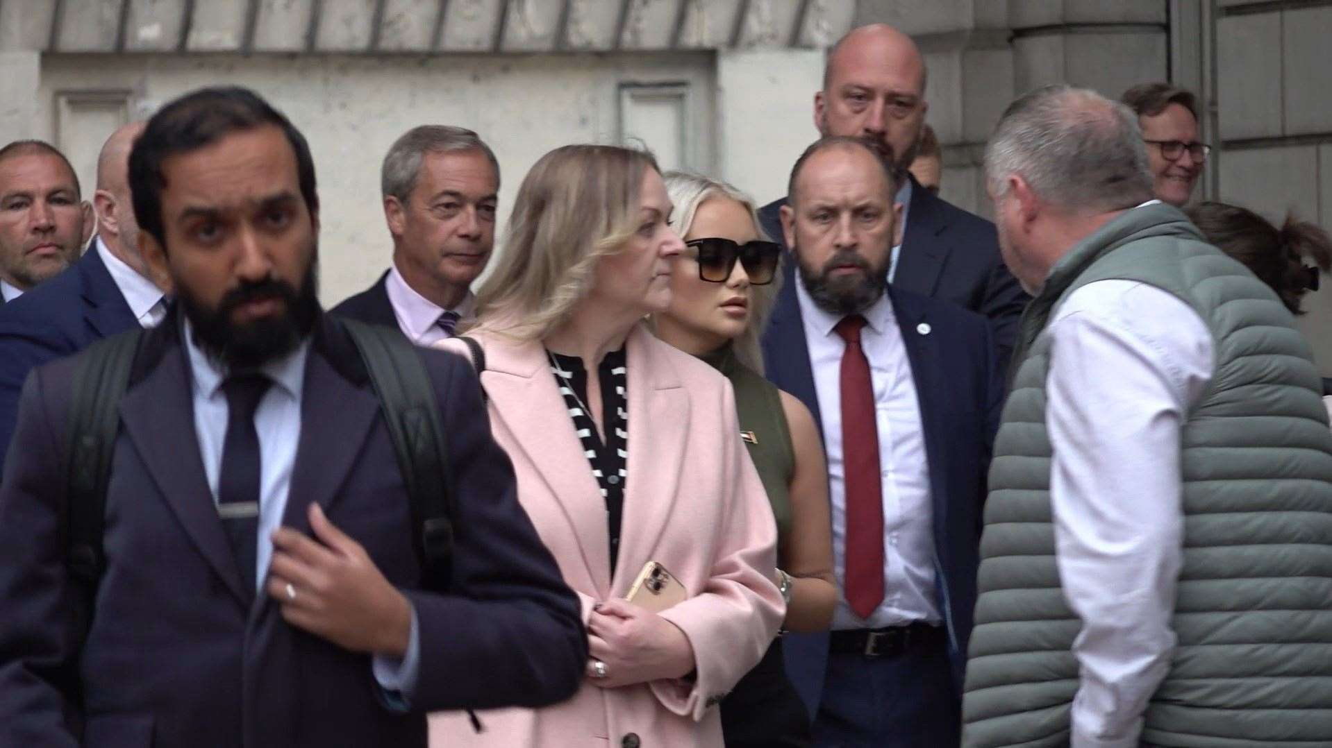 Reform UK leader Nigel Farage (4th from left) and Victoria Thomas Bowen (6th from left) arrive at Westminster Magistrates’ Court (PA Video)