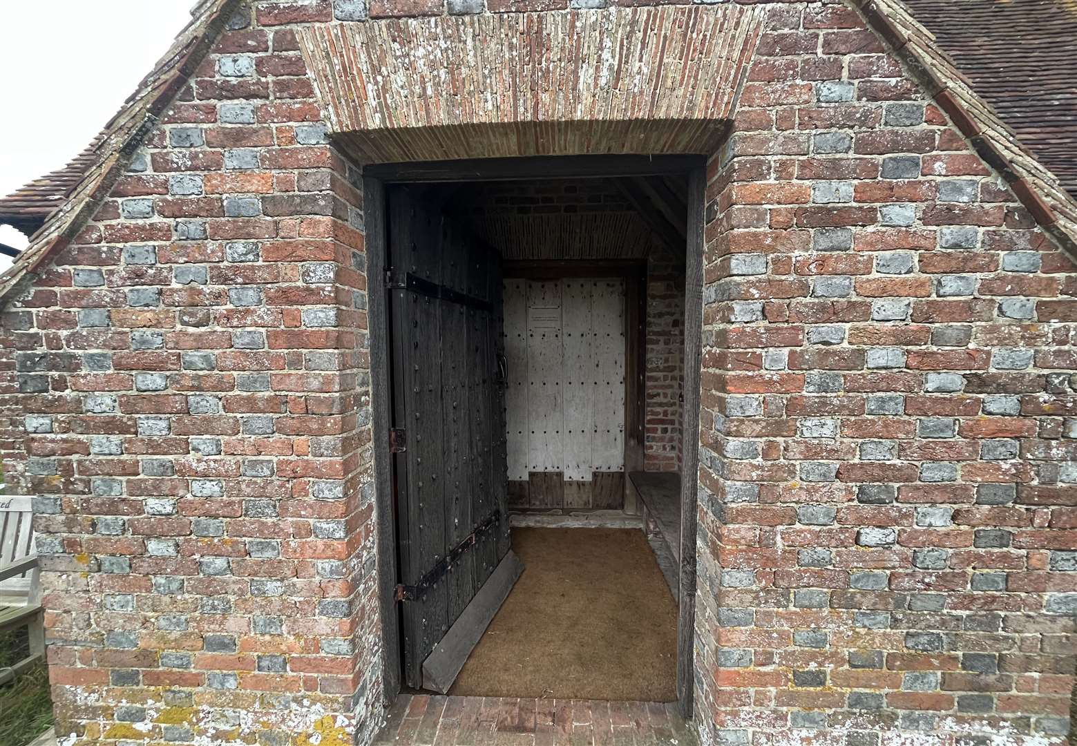 A pair of timber doors slowly creek open as I enter the church