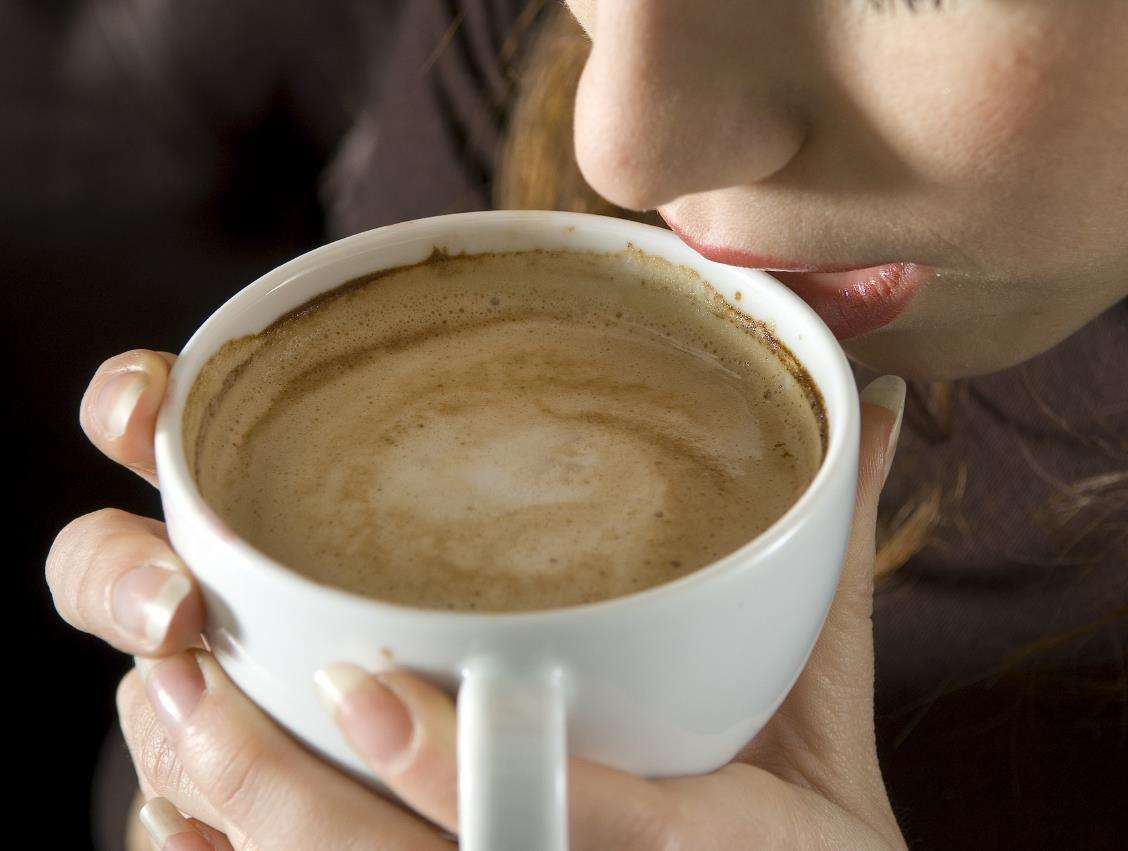 Woman drinking coffee. Stock pic. (1917388)