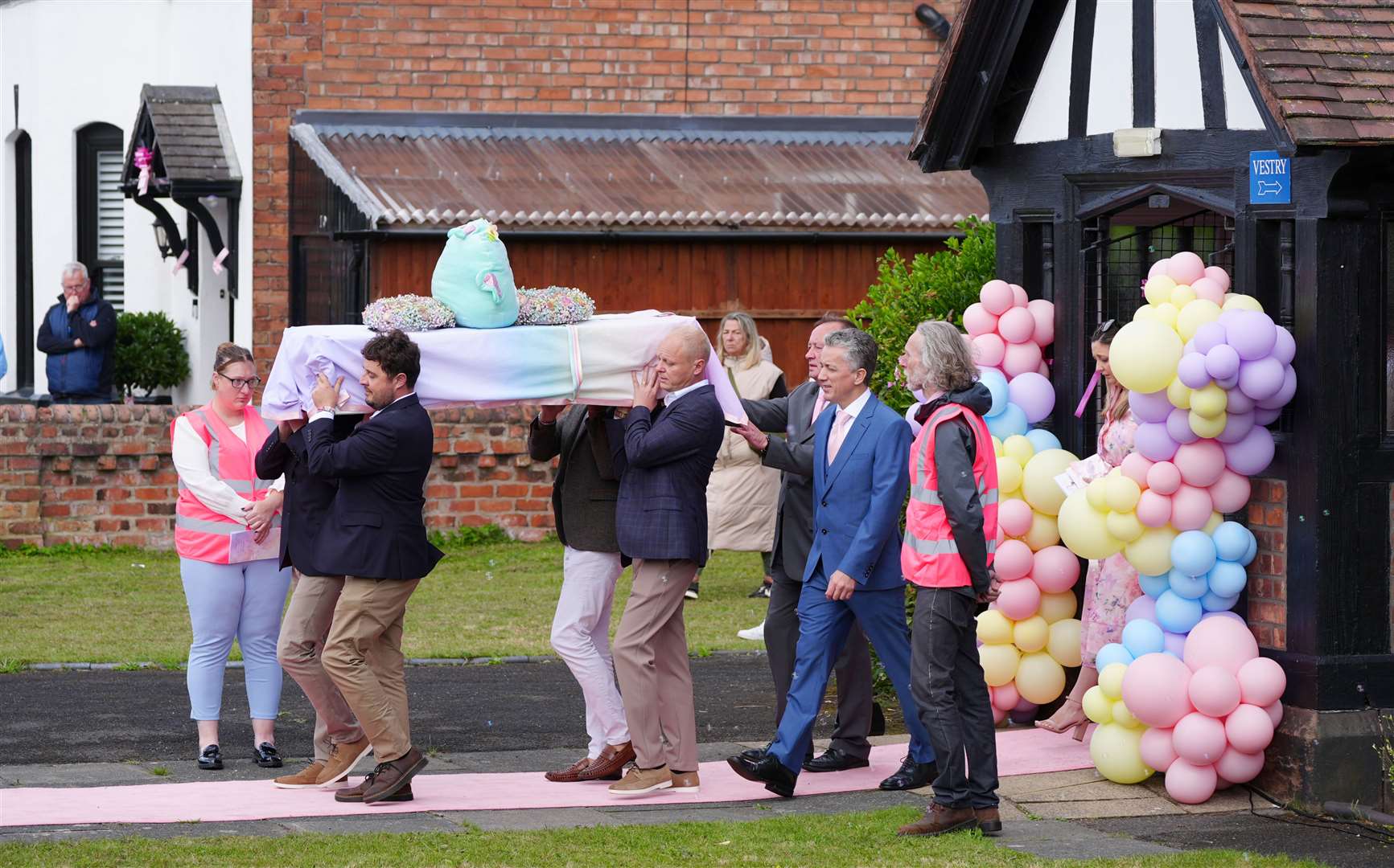 The coffin is carried out of St John’s Church in Birkdale (Peter Byrne/PA)