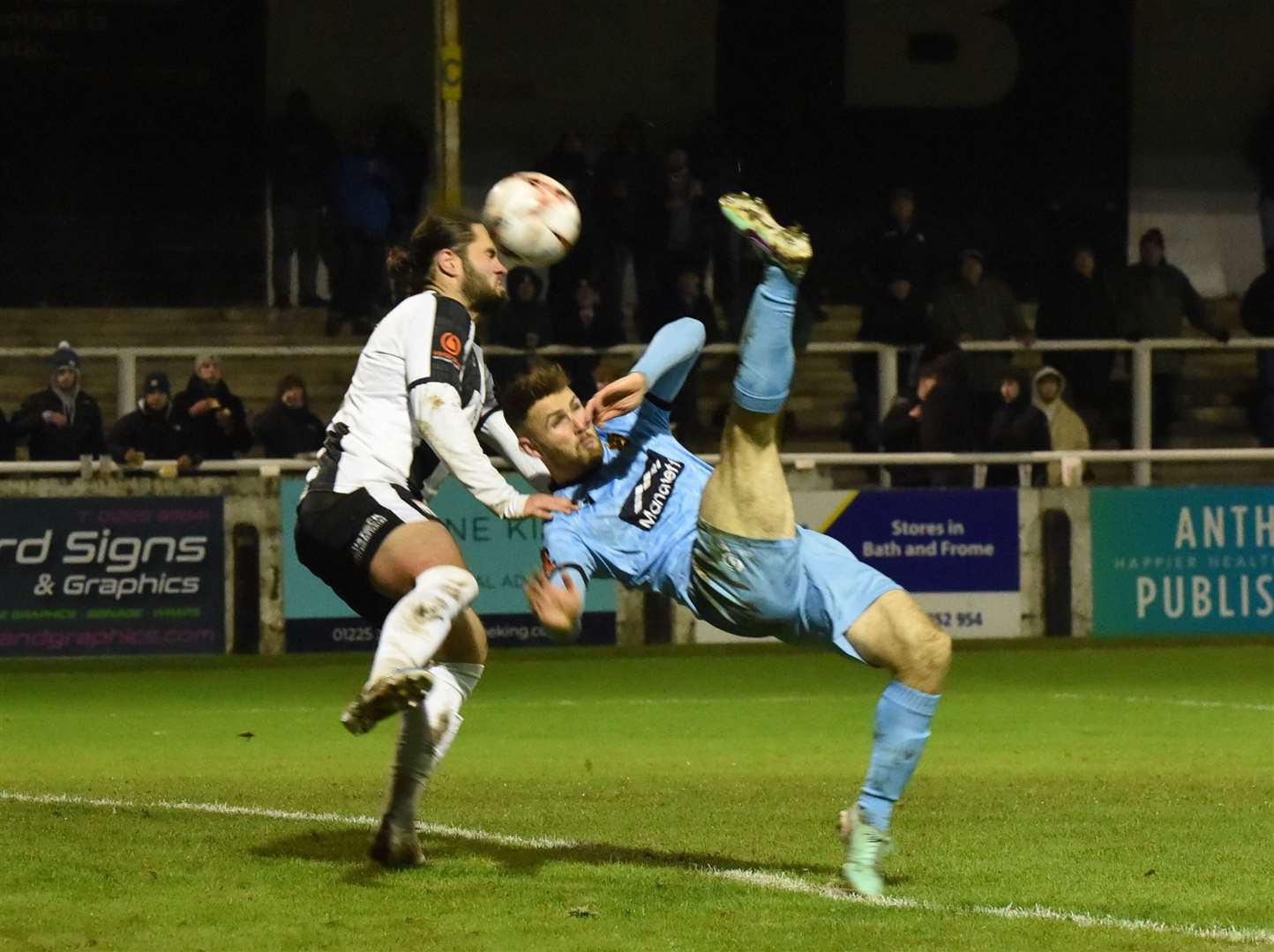 Maidstone defender George Fowler hooks the ball on at Bath. Picture: Steve Terrell