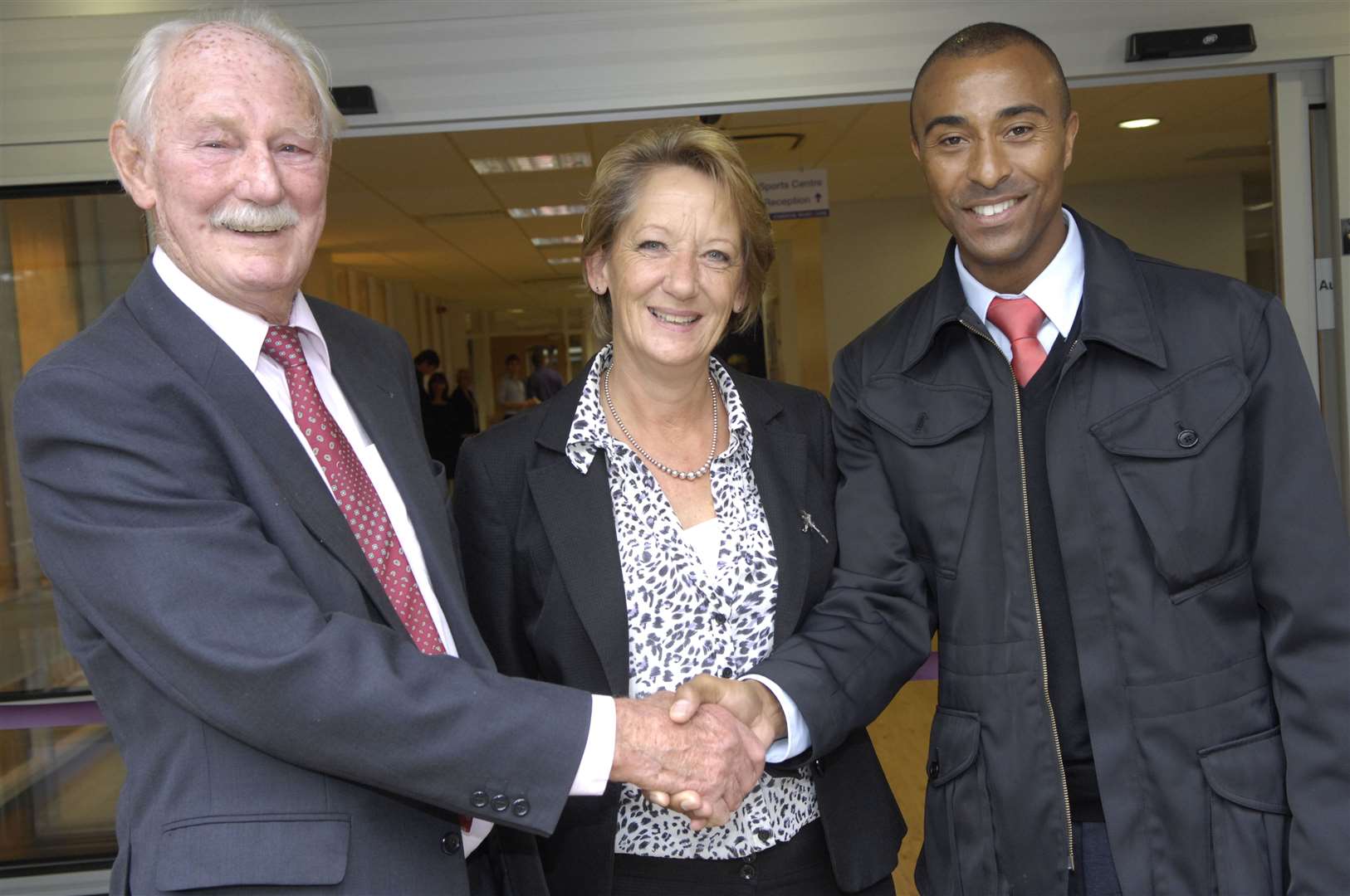 Derek Searle, chairman of trustees, manager Tessa Stickler and star athlete Colin Jackson unveil the centre improvements in 2010