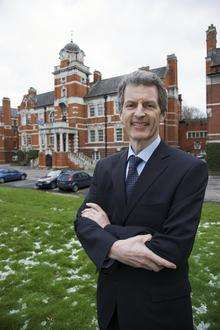 Professor David Maguire outside the Pembroke building at Chatham Maritime