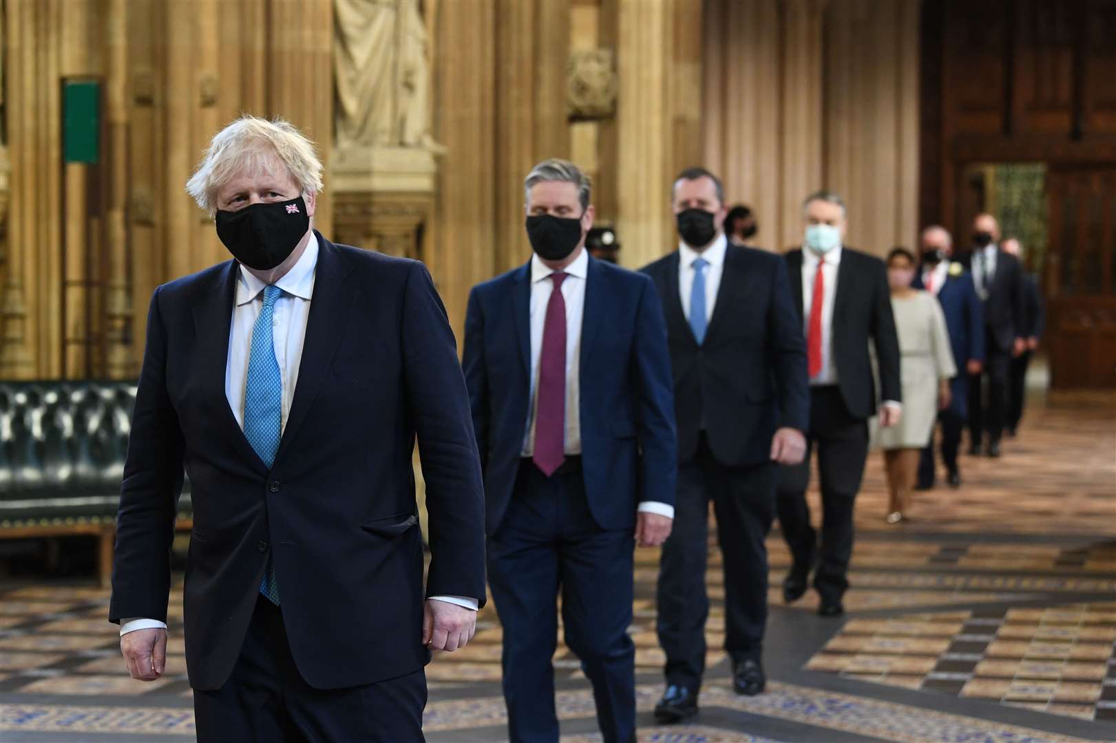 Prime Minister Boris Johnson (left) and Labour leader Sir Keir Starmer (2nd left) walk through the Central Lobby (Stefan Rousseau/PA)