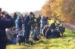 A crowd of birdwatchers gather to catch a glimpse of the green heron