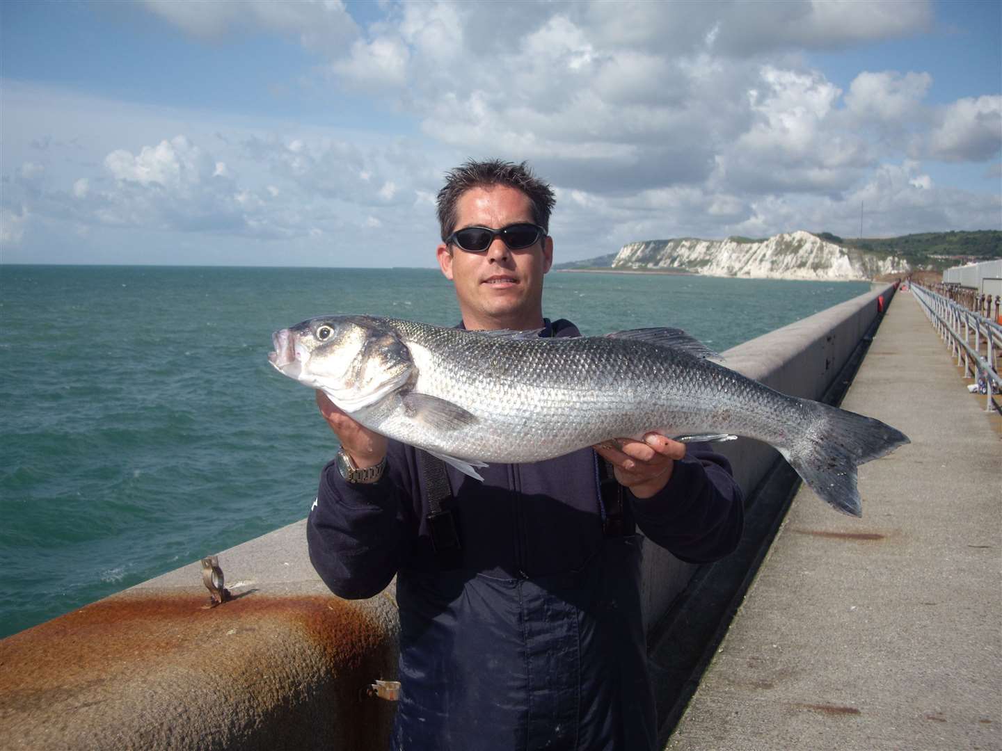 Brian Price with a 10lb 5oz bass caught off the Admiralty Pier in Dover Picture: Alan Yates