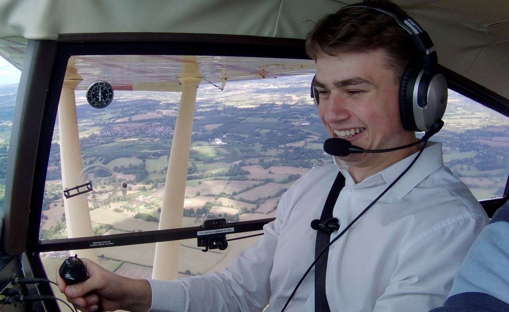 Reporter Joe Crossley having a go at flying a plane over Kent