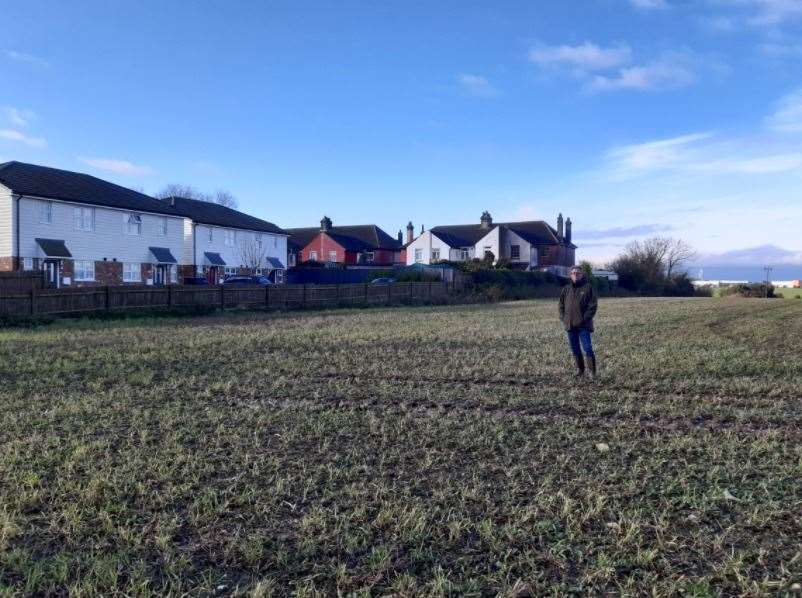 Guston resident David Dunford stands 25m away from the current boundary to show how close the back end of the border point could be