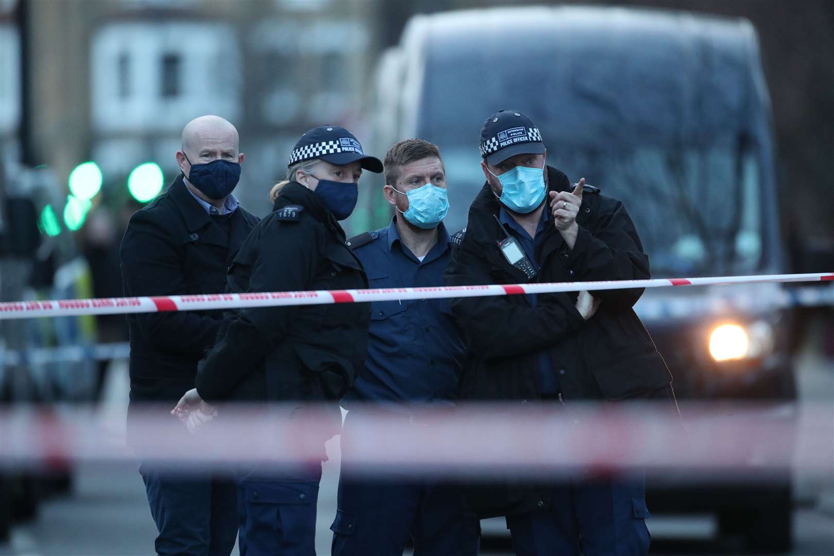 Police officers outside Poynders Court on the A205 in Clapham (Yui Mok/PA)