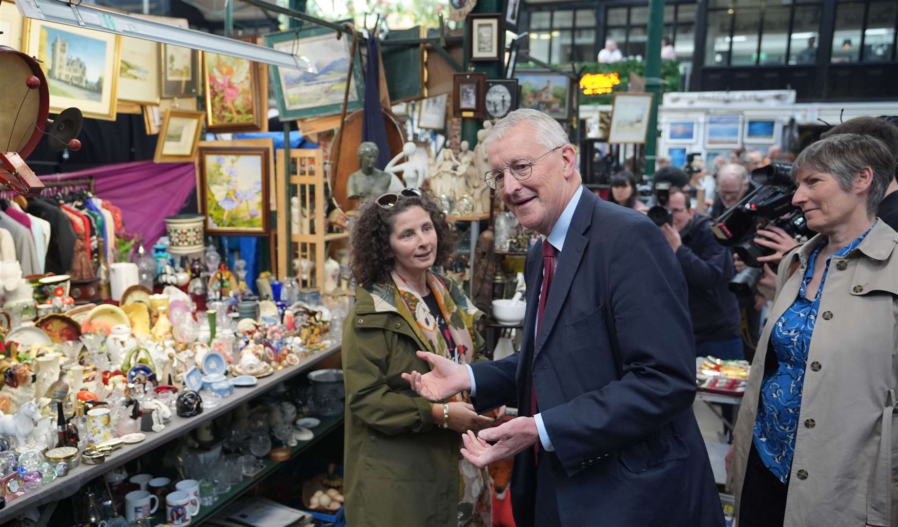 Northern Ireland Secretary Hilary Benn speaks with a market trader (Niall Carson/PA)