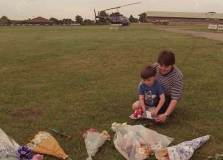 Laying flowers at the scene of the crash