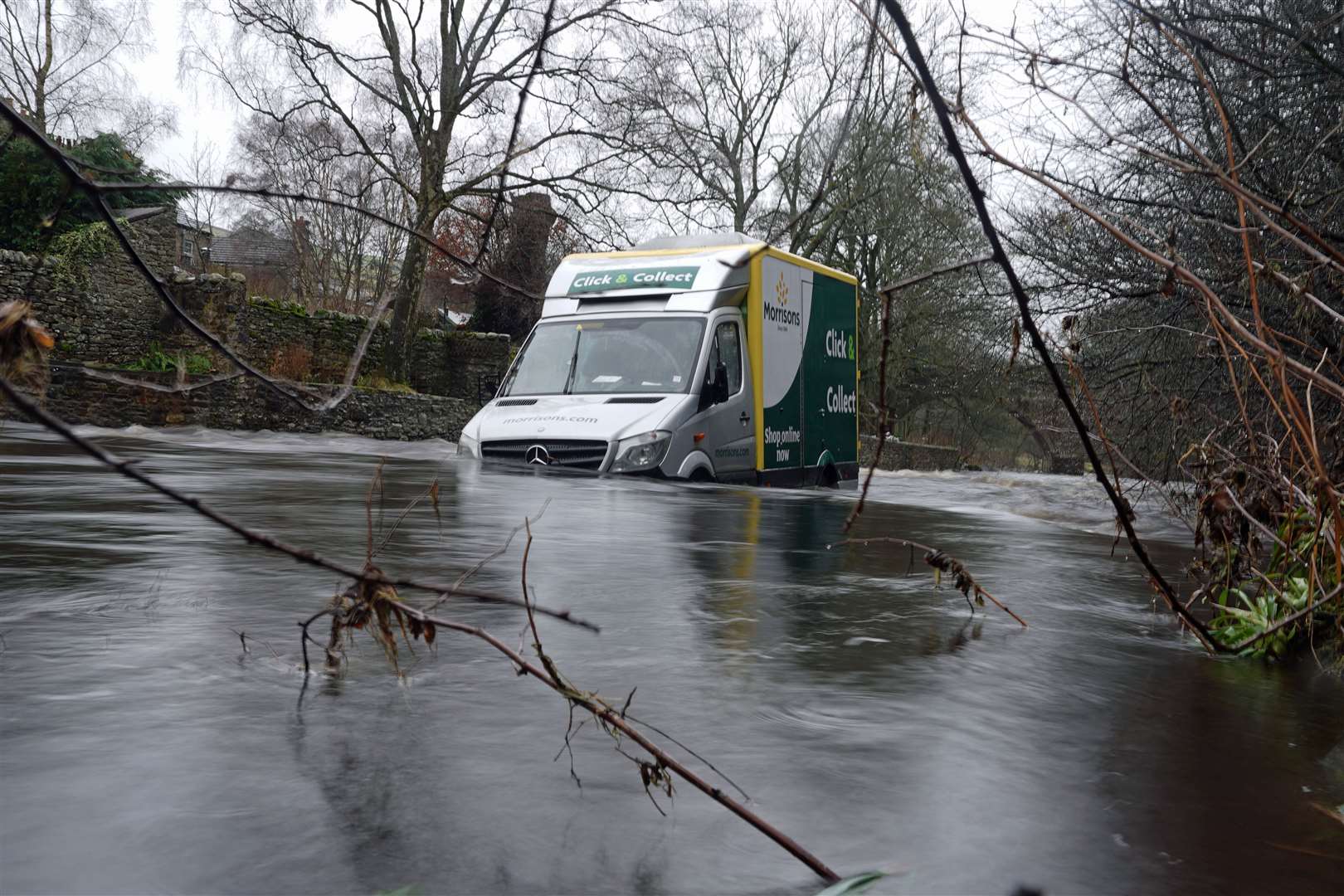 The fast-flowing water was swollen with snow melt (Owen Humphreys/PA)